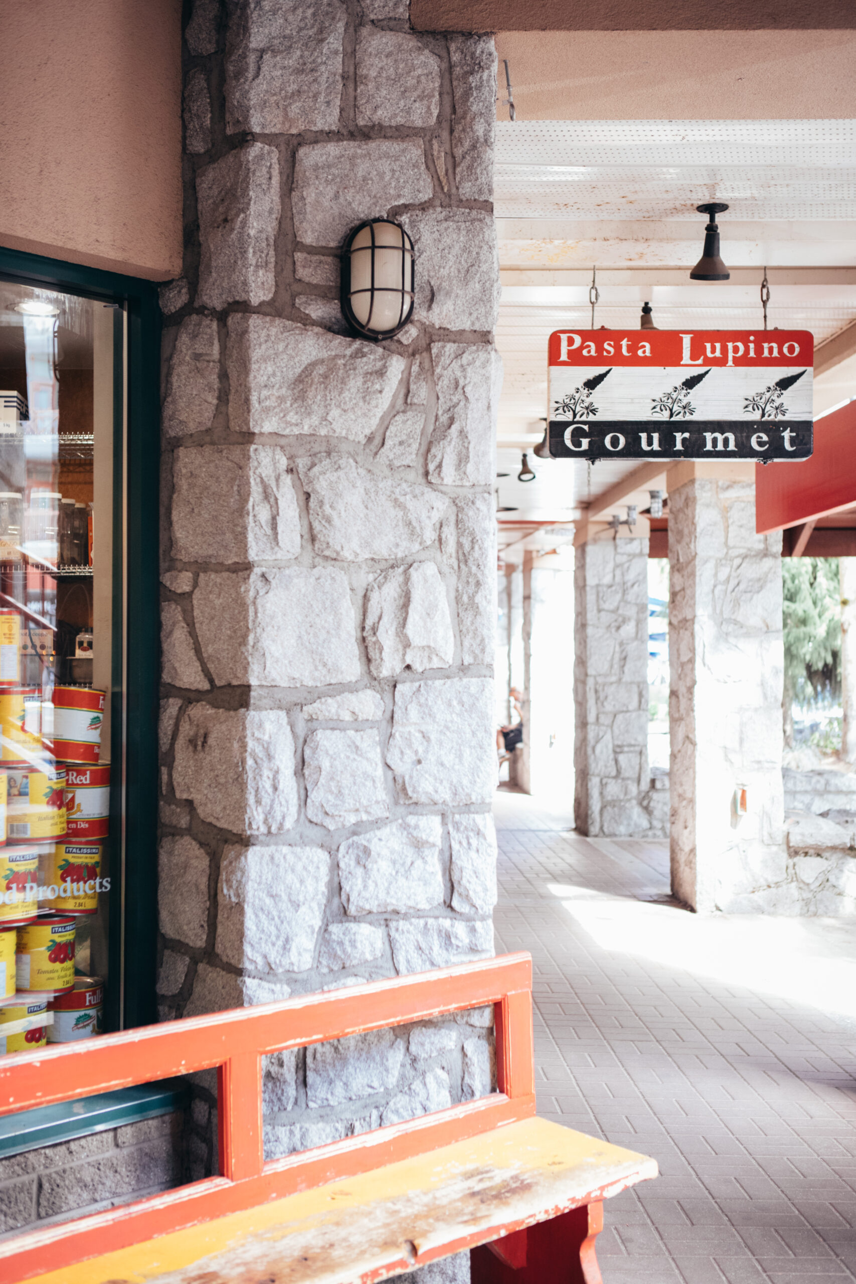 Entrance to Pasta Lupino restaurant in Whistler with the sign in view.